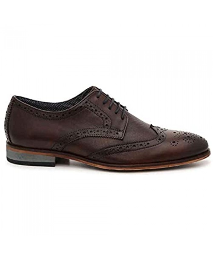 Modern Fiction Men's Dress Shoe Annotation Perforated Leather Wingtip Oxford. Versatile Lace-Up Shoe with Mix Material Details a Breathable Textile Lining and Durable Non-Slip Rubber Outsole